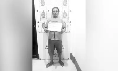 Suspect Flashes Dirty Finger in Mugshot After Disco Stabbing in Naga City