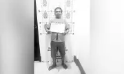 Suspect Flashes Dirty Finger in Mugshot After Disco Stabbing in Naga City